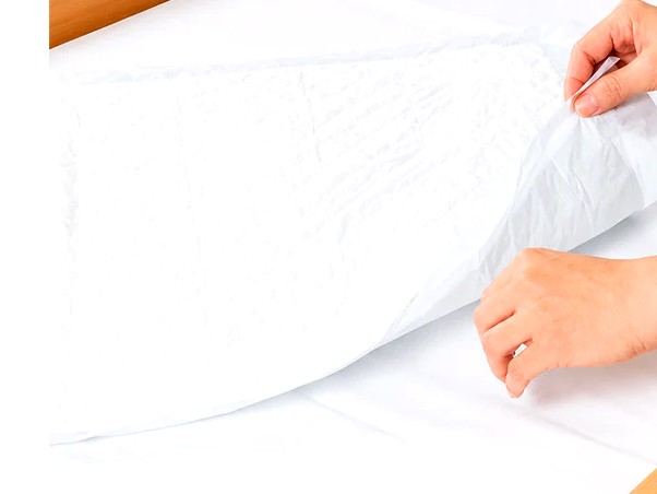 Empapador absorbente de cama — familia Fungible y absorbentes